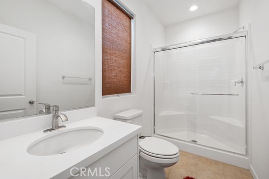 165 Frame Irvine, CA 92618 - Photo 33 of 37 a bathroom with a sink toilet and shower