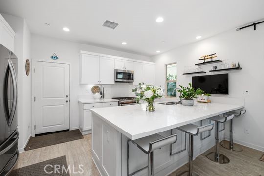 165 Frame Irvine, CA 92618 - Photo 6 of 37 a kitchen with sink cabinets and microwave