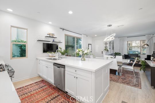 165 Frame Irvine, CA 92618 - Photo 7 of 37 a kitchen with white cabinets and sink