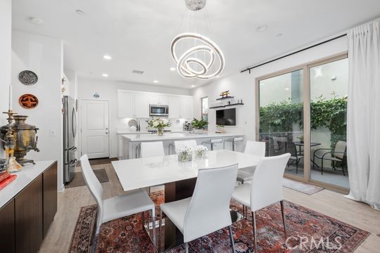 165 Frame Irvine, CA 92618 - Photo 8 of 37 a view of a dining room with furniture window and wooden floor