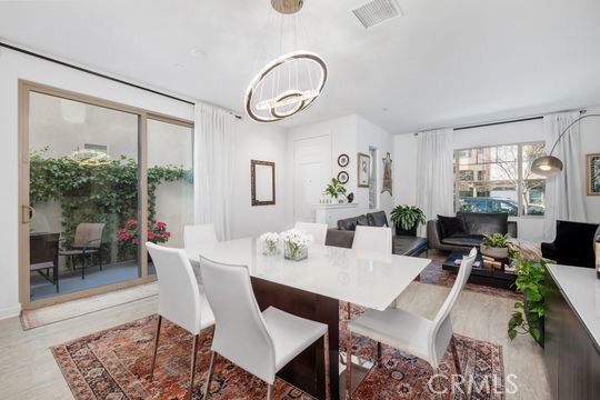 165 Frame Irvine, CA 92618 - Photo 9 of 37 a view of a dining room with furniture window and wooden floor
