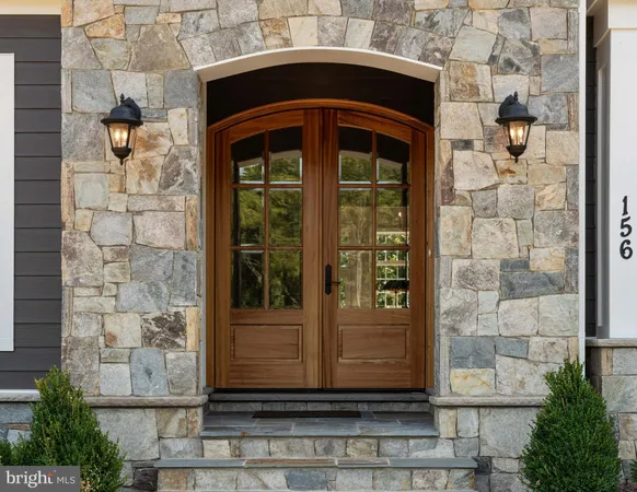 a front view of a house with a glass door
