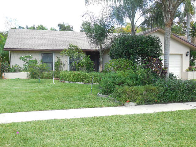 18070 102nd Way South Boca Raton, FL 33498 - Photo 1 of 24 Front with Lush Landscaping