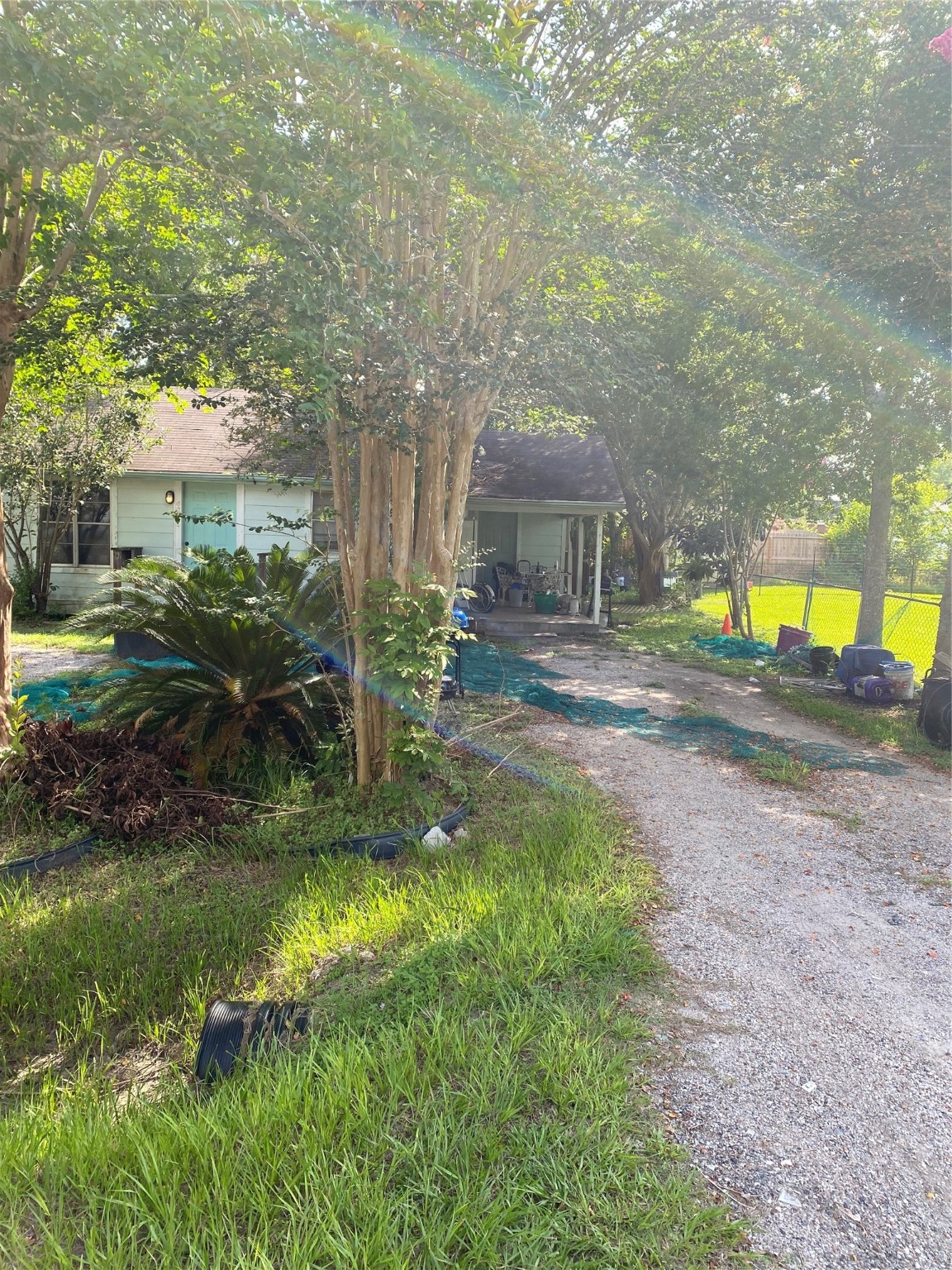 a view of a house with a yard and sitting area