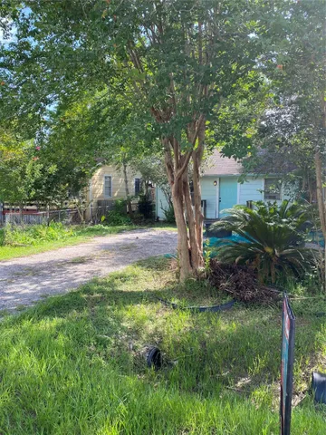 a backyard of a house with lots of green space