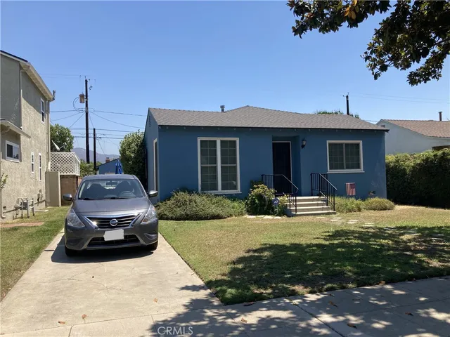 a car parked in front of a house