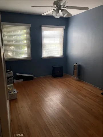 a bedroom with bed and window