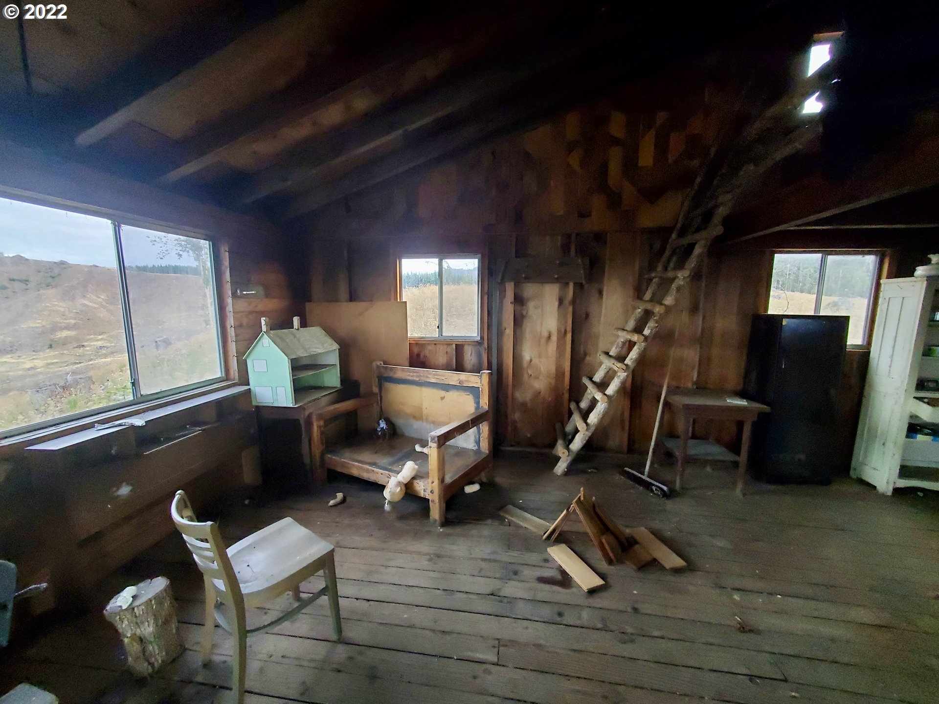 21475 Stone (across From) Road Sheridan, OR 97378 - Photo 21 of 24 a room with wooden furniture and a rug