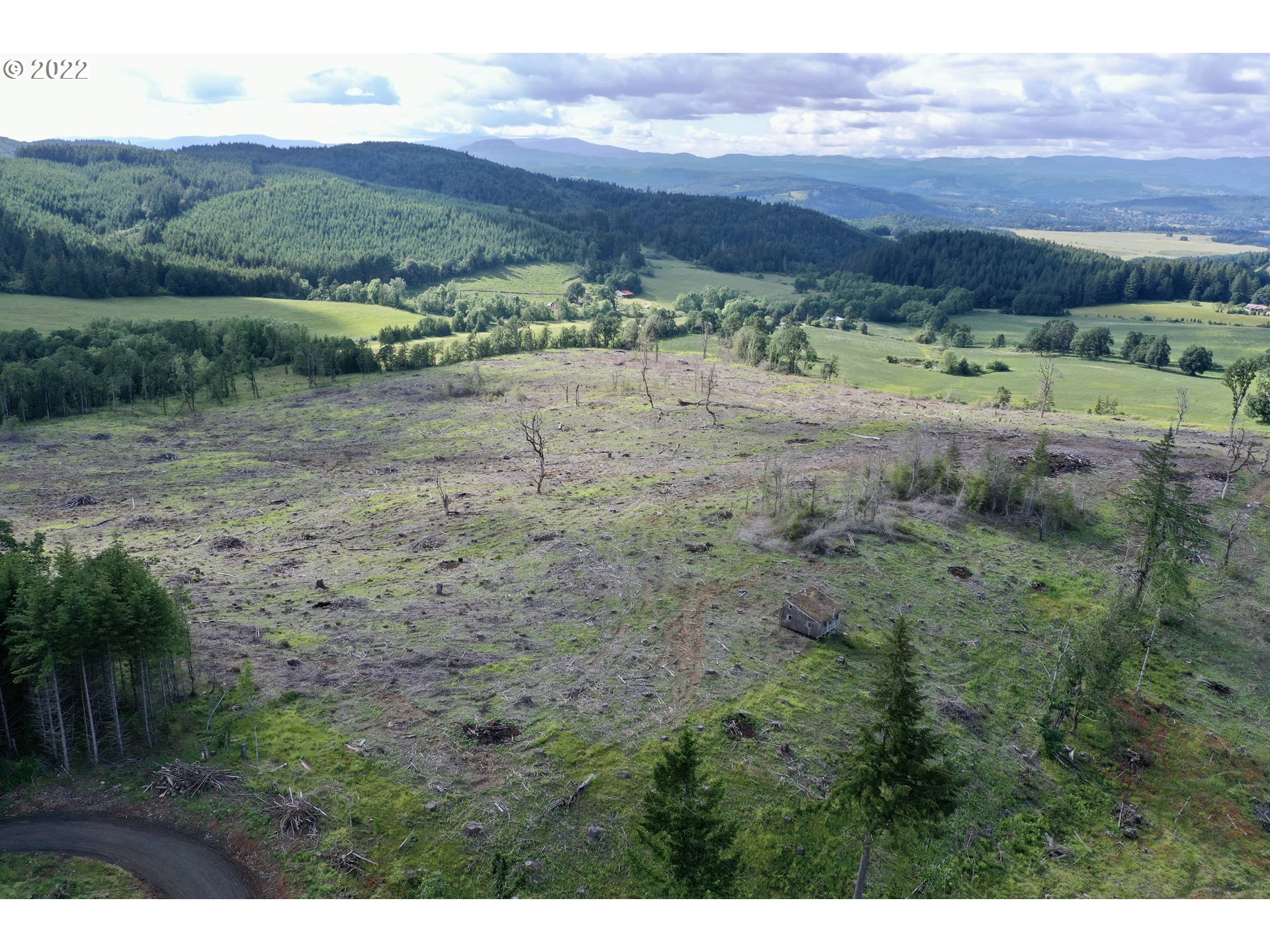 21475 Stone (across From) Road Sheridan, OR 97378 - Photo 3 of 24 a view of a lush green hillside and houses