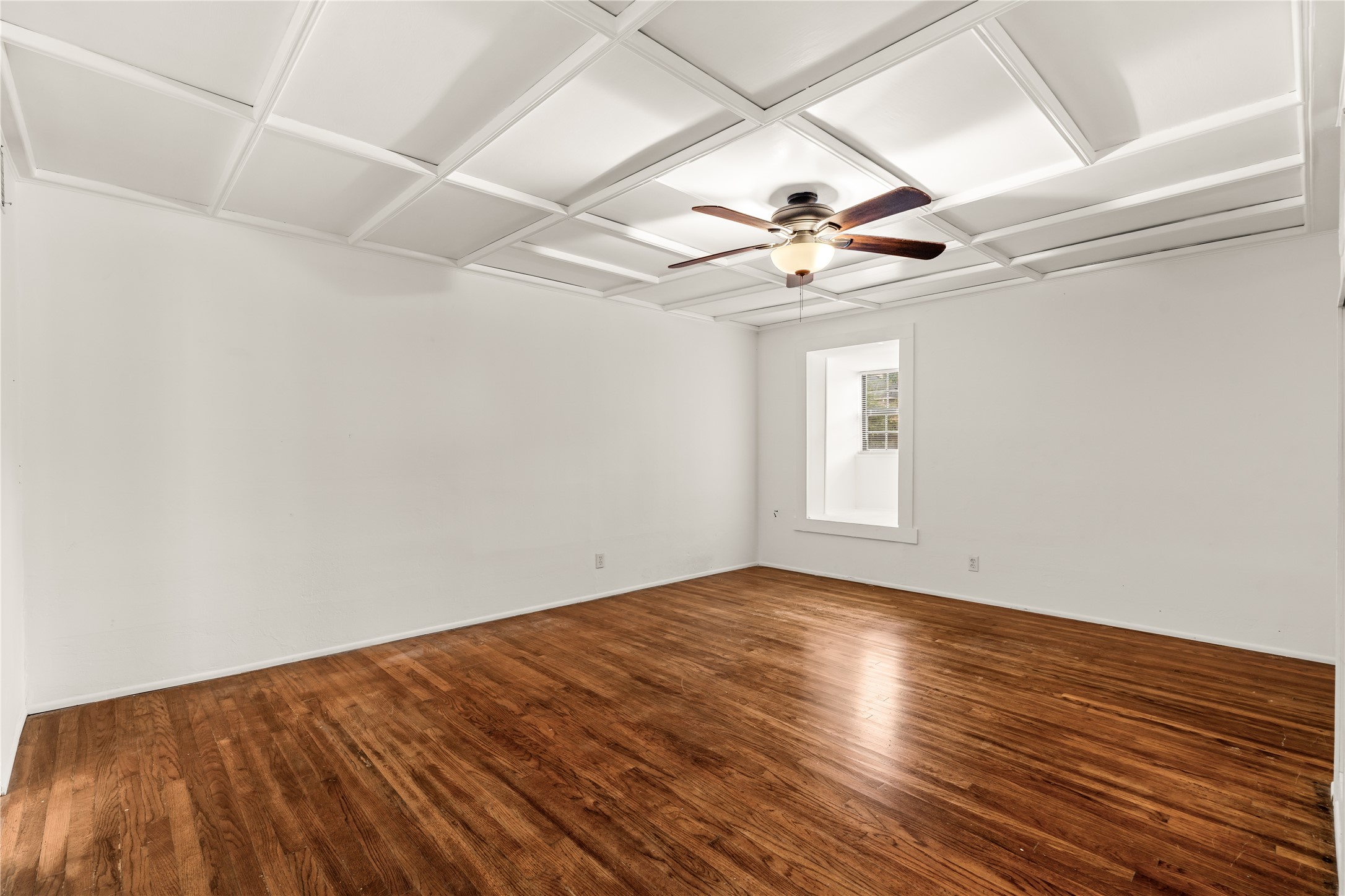 2202 West Main Street Houston, TX 77098 - Photo 15 of 32 wooden floor in an empty room