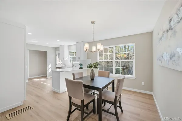 a dining room with furniture window and outside view