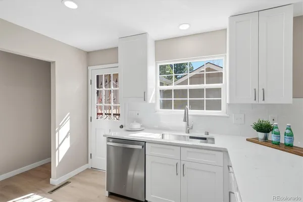 a kitchen with a sink and a window