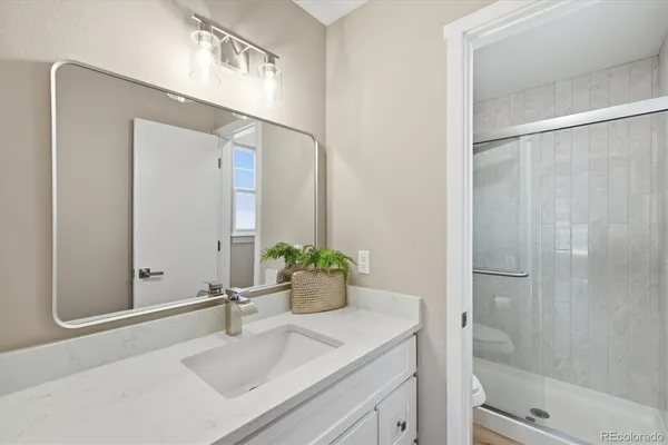 a bathroom with a sink and mirror