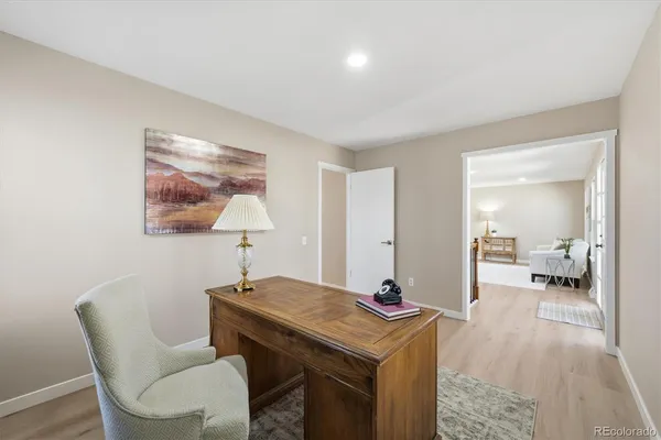 a view of a room with a table and chairs