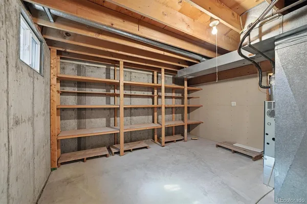 a view of an empty room with a staircase