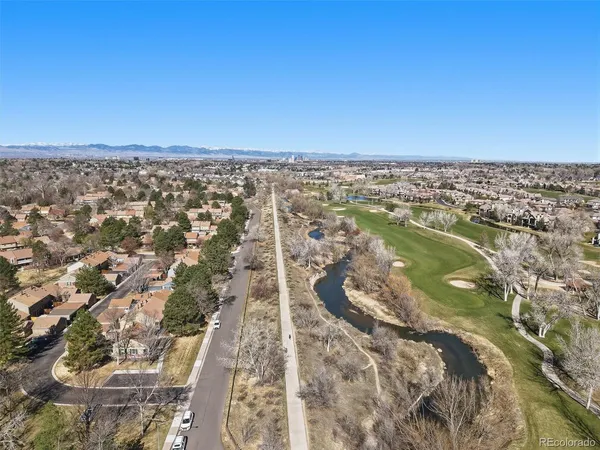 an aerial view of residential building and car parked