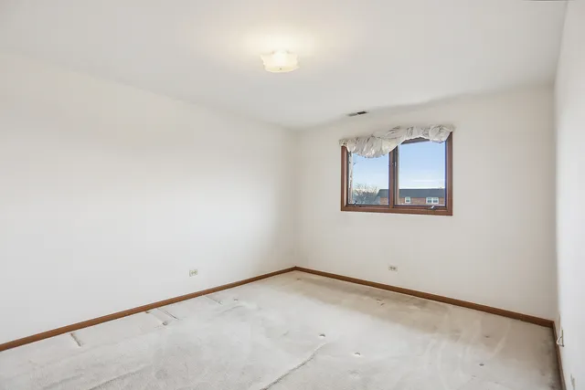 an empty room with a empty space and window