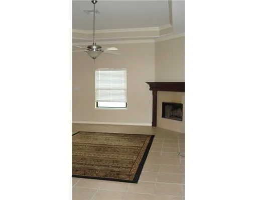 a living room with a couch and a window