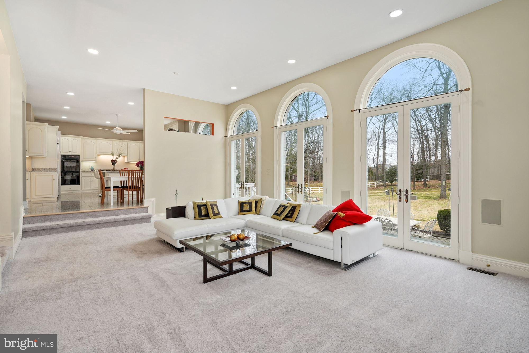 11505 Glen Road Potomac, MD 20854 - Photo 23 of 66 A trio of transom-topped atrium doors