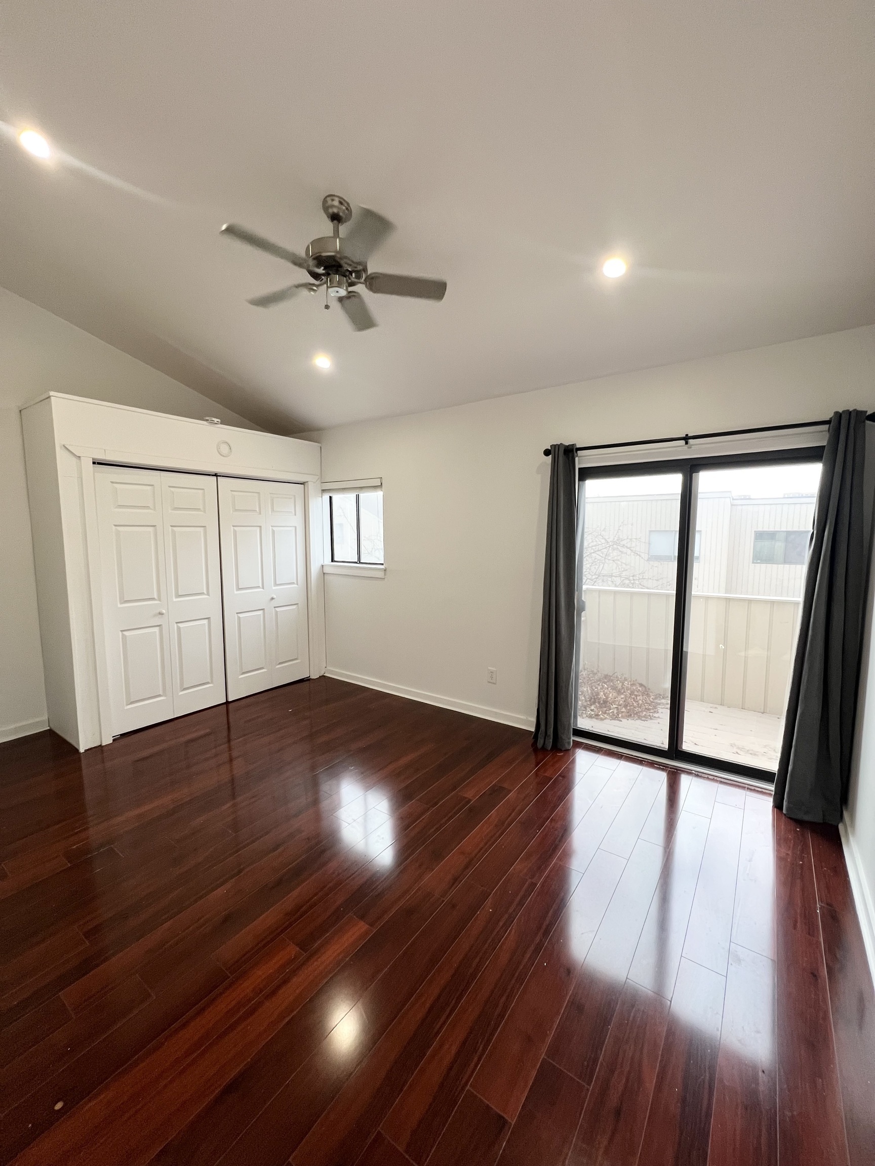 100 Hope Street, Unit 10 Stamford, CT 06906 - Photo 7 of 14 a view of an empty room with wooden floor and a window