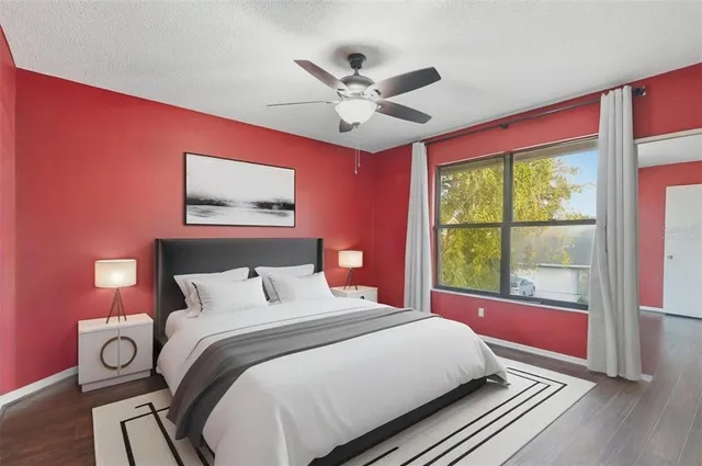 a bedroom with a large bed and a window