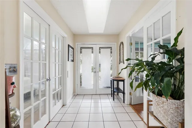 a entryway with furniture and a potted plant