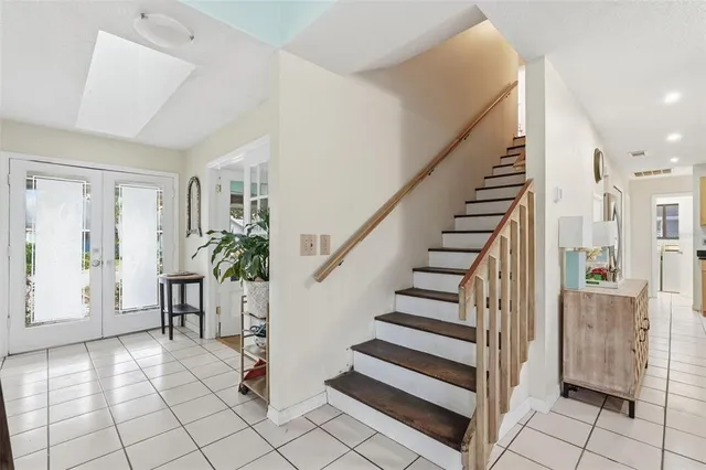 a view of entryway with furniture and wooden floor