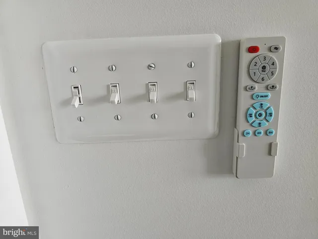 a utility room with window and refrigerator
