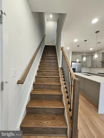 a view of staircase with white walls and floors