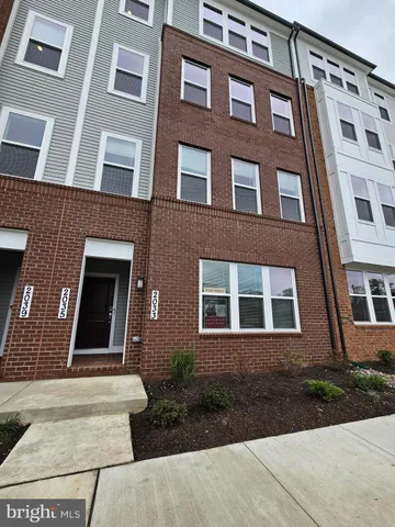 a front view of a building with yard