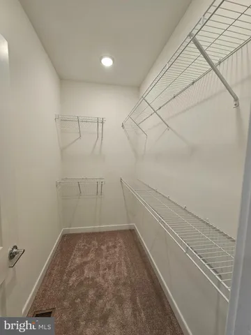 a view of a room with racks on the wall