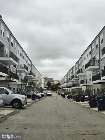 a view of a house with swimming pool and sitting area