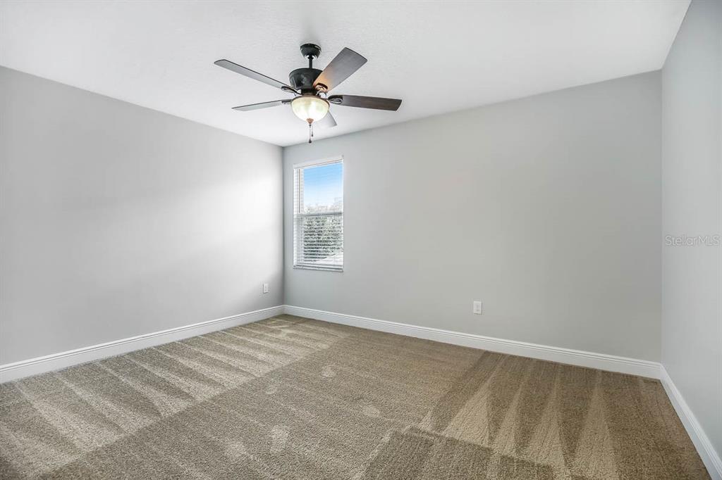 5310 Match Point Place Lithia, FL 33547 - Photo 16 of 33 a view of a room with a ceiling fan