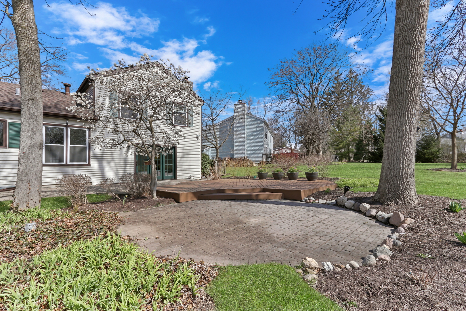 1346 Deer Run Road Gurnee, IL 60031 - Photo 29 of 36 a view of a garden with tall trees
