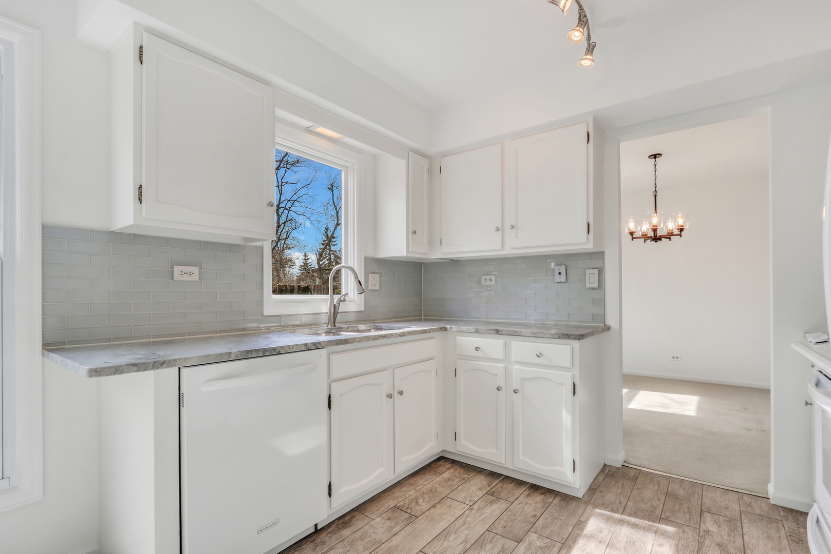 1346 Deer Run Road Gurnee, IL 60031 - Photo 7 of 36 a kitchen with a sink cabinets and window