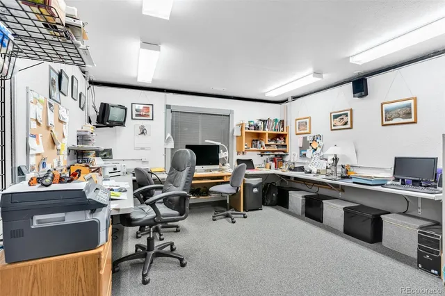 a view of a workspace with kitchen