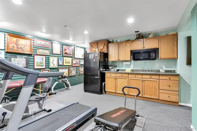 a view of a kitchen with furniture and a window