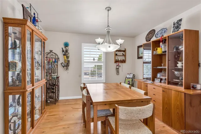 a view of a dining room with furniture window and wooden floor