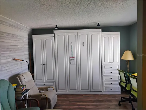 a view of a livingroom with furniture and wooden floor