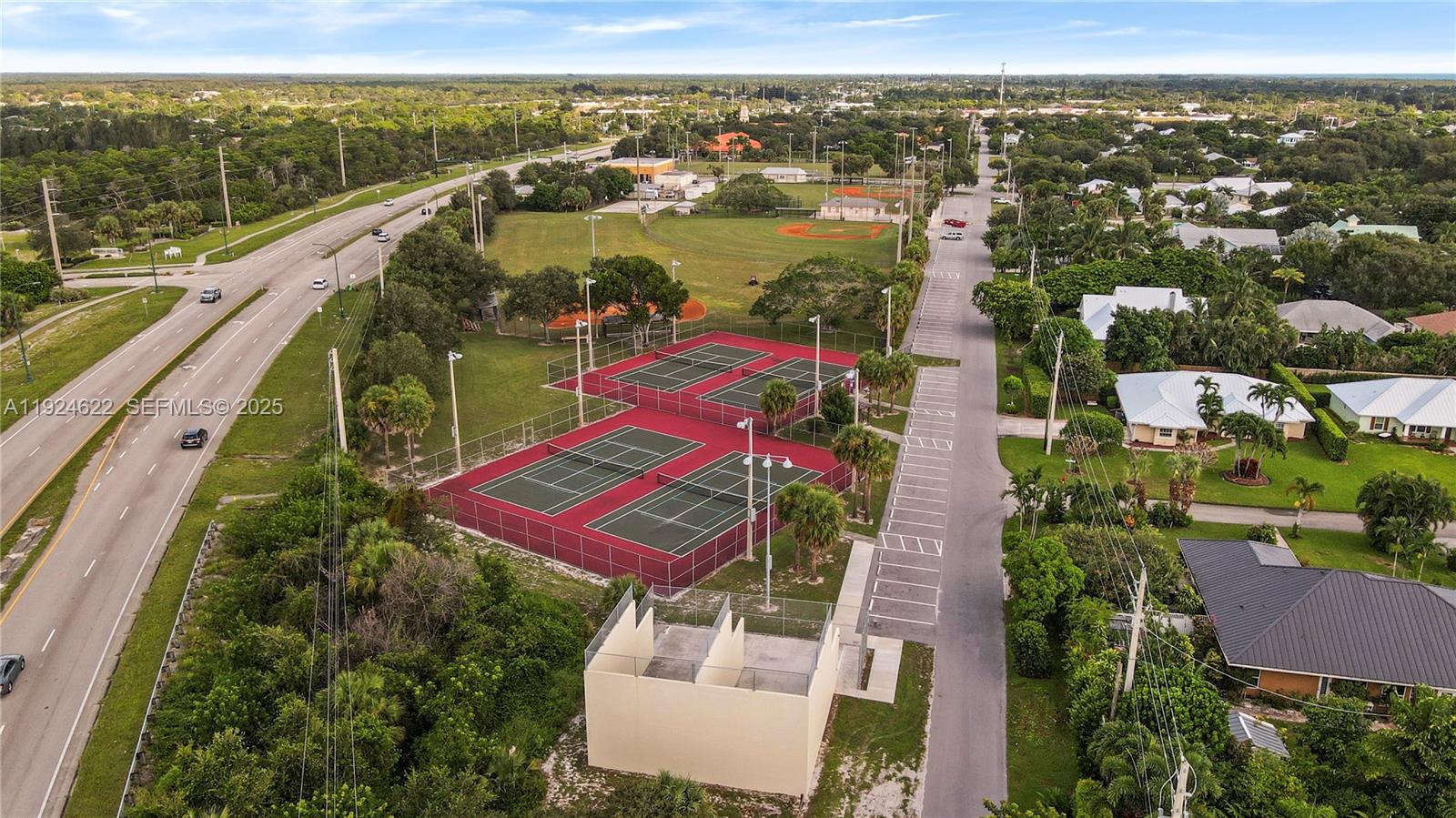 9155 Southeast Athena Street Hobe Sound, FL 33455 - Photo 25 of 25 an aerial view of residential houses with outdoor space and river