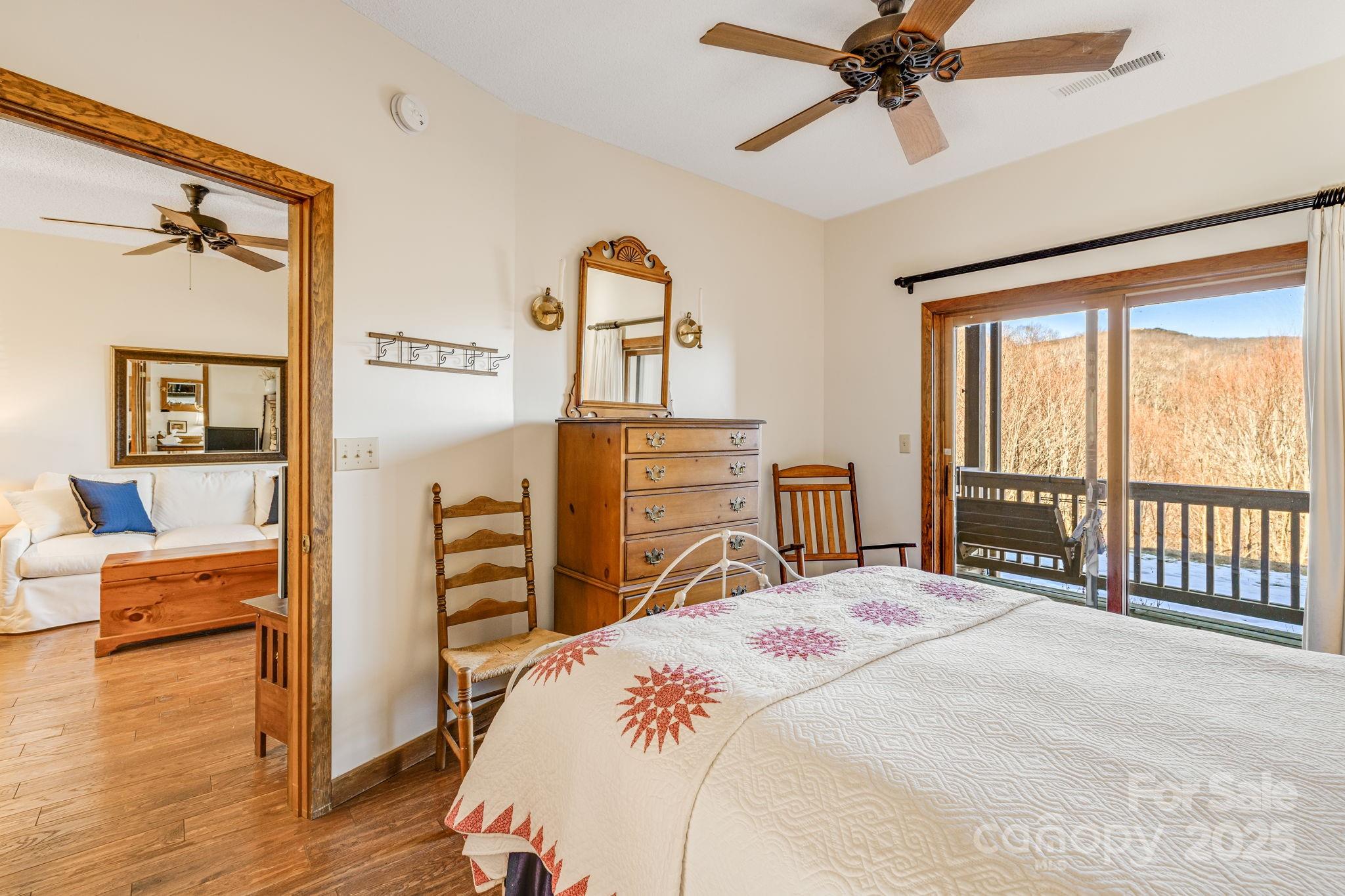 2521 Wolf Laurel Road, Unit 104 Mars Hill, NC 28754 - Photo 18 of 47 a bedroom with a bed and wooden floor