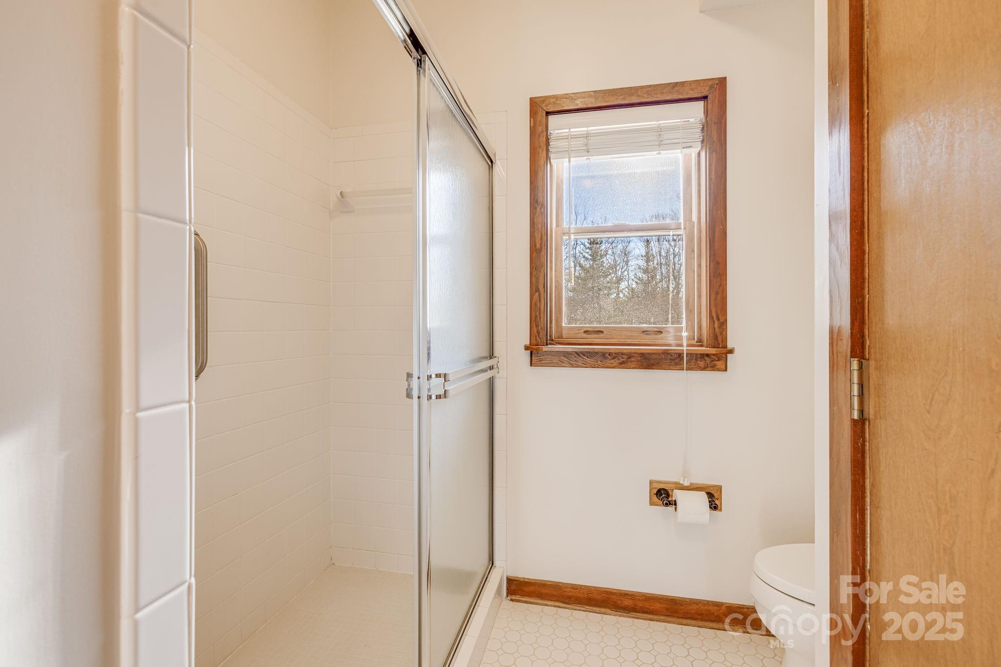 2521 Wolf Laurel Road, Unit 104 Mars Hill, NC 28754 - Photo 20 of 47 a bathroom with a shower and a sink