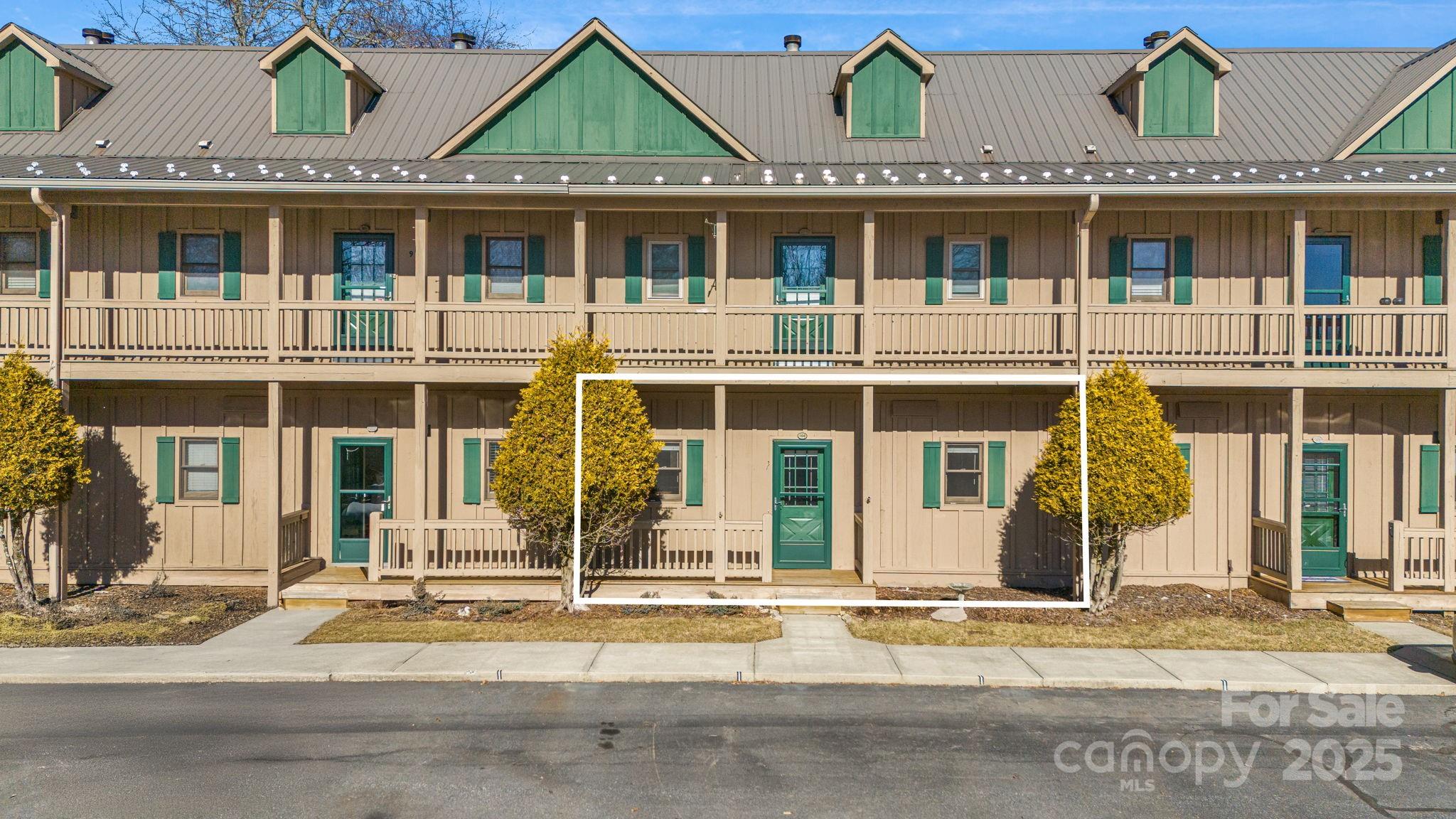 2521 Wolf Laurel Road, Unit 104 Mars Hill, NC 28754 - Photo 2 of 47 front view of a house with a view of a building