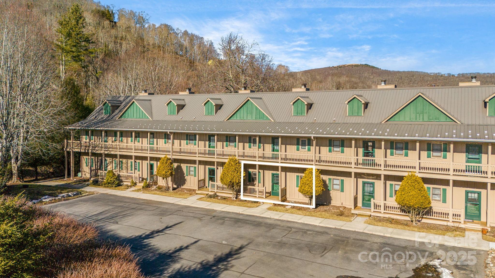 2521 Wolf Laurel Road, Unit 104 Mars Hill, NC 28754 - Photo 29 of 47 front view of a house with a street