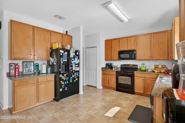 a living room with furniture and a gym machine