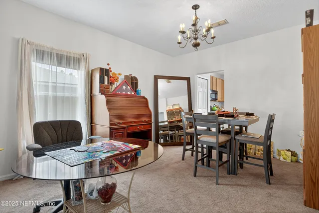 a spacious bathroom with a tub sink and mirror