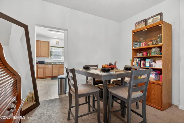 an aerial view of residential house with outdoor space and swimming pool