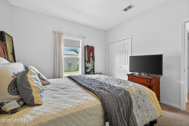 an aerial view of residential houses with outdoor space and street view