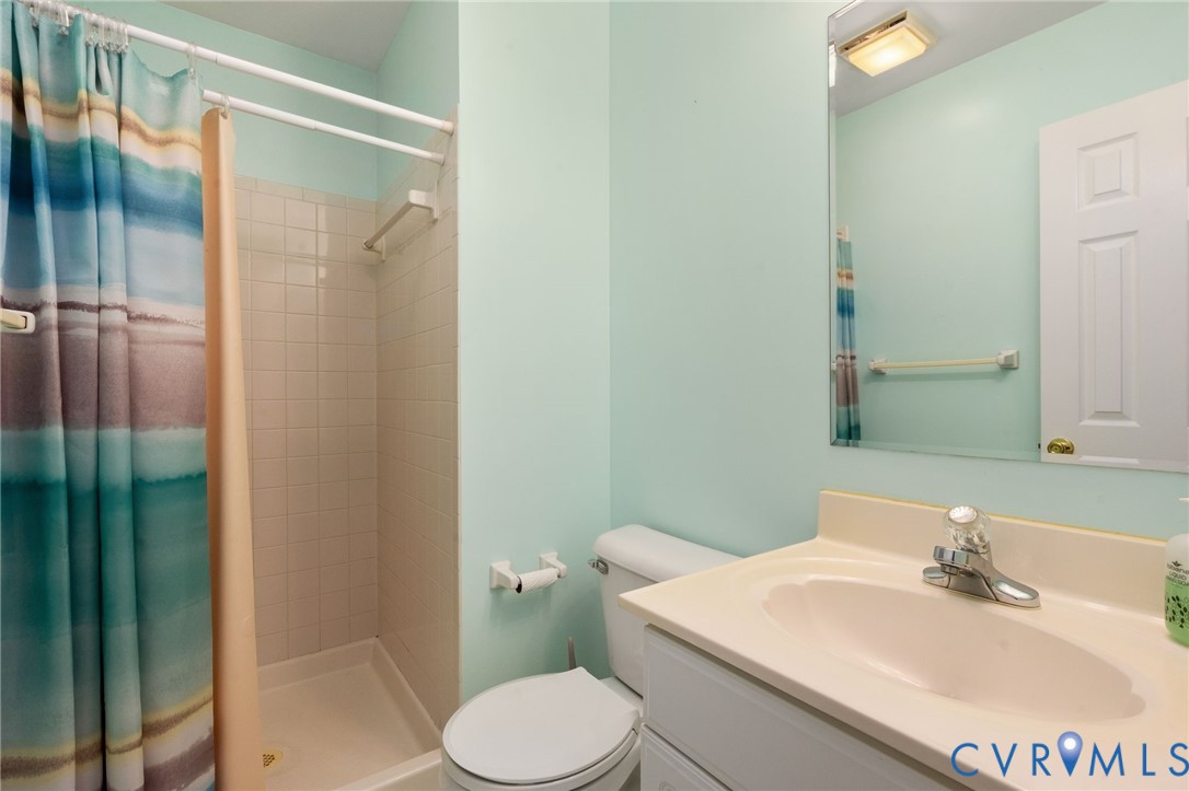 16379 Arch Hill Road Hanover, VA 23069 - Photo 12 of 26 a bathroom with a sink toilet and shower
