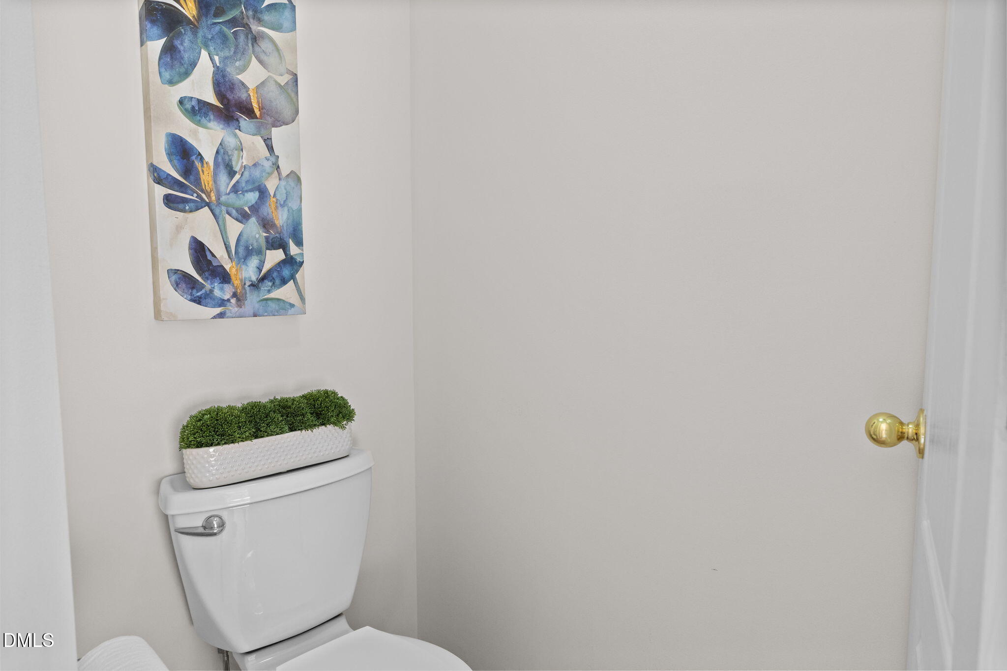 104 Saddle River Road Apex, NC 27502 - Photo 16 of 42 a white toilet sitting next to a shower curtain